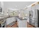 Bright and modern kitchen featuring an island, stainless steel appliances, and a breakfast nook at 12531 Kane Alexander Dr, Huntersville, NC 28078
