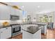 Updated kitchen with white cabinets, granite countertops, stainless appliances and eat in breakfast nook at 12531 Kane Alexander Dr, Huntersville, NC 28078
