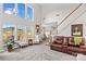 Open living space with large windows, a staircase, and comfortable seating arrangements at 12531 Kane Alexander Dr, Huntersville, NC 28078