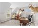 Well-lit office with a deer head, desk, and large windows at 12531 Kane Alexander Dr, Huntersville, NC 28078