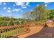 Enjoy the view from this expansive wooden deck with classic railings and an American flag waving at 12531 Kane Alexander Dr, Huntersville, NC 28078
