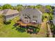 Stunning backyard featuring a spacious deck, perfect for entertaining, with lush landscaping at 12531 Kane Alexander Dr, Huntersville, NC 28078