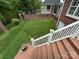 View of the backyard from a deck, featuring green space and brick accents at 127 Victoria Park Dr, Shelby, NC 28150