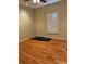 Bedroom featuring hardwood floors, window with shutters, and warm lighting at 127 Victoria Park Dr, Shelby, NC 28150