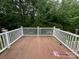 Spacious wooden deck surrounded by white railings, perfect for outdoor entertaining at 127 Victoria Park Dr, Shelby, NC 28150