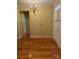 View of the entryway with hardwood floors and a chandelier at 127 Victoria Park Dr, Shelby, NC 28150