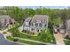Aerial view showcasing the home, landscaping, and surrounding neighborhood at 13713 Sunset Bluffs Cir, Huntersville, NC 28078