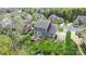 Rear aerial view of a home featuring a deck, landscaped yard, and a patio at 13713 Sunset Bluffs Cir, Huntersville, NC 28078