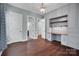 Spacious bedroom with hardwood floors, custom built-in desk and shelving unit with drawers and cabinets at 13713 Sunset Bluffs Cir, Huntersville, NC 28078