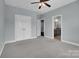 Neutral bedroom with carpet and attached bathroom and closet at 13713 Sunset Bluffs Cir, Huntersville, NC 28078