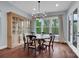 Dining room with hardwood floors, a large window, and traditional furnishings at 13713 Sunset Bluffs Cir, Huntersville, NC 28078