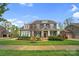 Beautiful two-story home with a manicured front yard and a side-entry garage at 13713 Sunset Bluffs Cir, Huntersville, NC 28078