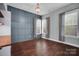 Bright flex room with hardwood floors, custom wall paneling, and natural light at 13713 Sunset Bluffs Cir, Huntersville, NC 28078