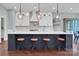 Bright kitchen showcases a large island with seating and modern pendant lighting at 13713 Sunset Bluffs Cir, Huntersville, NC 28078