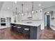 Gourmet kitchen with a large island, pendant lighting, and stainless steel appliances at 13713 Sunset Bluffs Cir, Huntersville, NC 28078