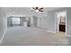 Large bonus room with plush carpet and natural light at 13713 Sunset Bluffs Cir, Huntersville, NC 28078
