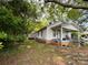 Charming single story home with covered front porch and lush green trees at 142 26Th Sw St, Hickory, NC 28602