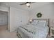Bright bedroom with plush bedding, ceiling fan, and ample closet space offering comfort and functionality at 15122 Lake Ridge Rd, Charlotte, NC 28278