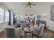 Spacious living room with an open layout, showcasing hardwood floors, comfortable seating, and a view to the kitchen at 15122 Lake Ridge Rd, Charlotte, NC 28278