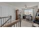 Well-lit home office space with desk, area rug, ample natural light, and a grandfather clock at 15122 Lake Ridge Rd, Charlotte, NC 28278