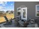 Back patio with outdoor seating, ideal for relaxation and enjoying the fresh air at 15122 Lake Ridge Rd, Charlotte, NC 28278