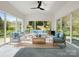 Bright sunroom with vaulted ceilings, large windows, and comfortable seating, perfect for relaxing at 1528 Ridge Haven Rd, Waxhaw, NC 28173