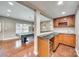 Basement bar area with custom cabinetry, granite countertops and wine refrigerator at 1813 Robbins Meadows Dr, Waxhaw, NC 28173