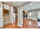 Finished basement with stained concrete floors, media area, and stairs to the main floor at 1813 Robbins Meadows Dr, Waxhaw, NC 28173