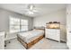 This cozy bedroom features a bed, ceiling fan, carpet flooring, and a fish aquarium at 1813 Robbins Meadows Dr, Waxhaw, NC 28173