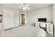 This cozy bedroom features a bed, carpet flooring, and an office space at 1813 Robbins Meadows Dr, Waxhaw, NC 28173
