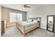 This cozy bedroom features a window, ceiling fan, and grey carpet flooring at 1813 Robbins Meadows Dr, Waxhaw, NC 28173