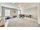 This bonus room includes carpet flooring, plenty of windows, and a foosball table at 1813 Robbins Meadows Dr, Waxhaw, NC 28173