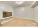 Bonus room with neutral carpet, perfect for use as a playroom or den at 1813 Robbins Meadows Dr, Waxhaw, NC 28173