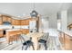 Spacious eat-in kitchen featuring a central island, modern appliances, and wood-look flooring at 1813 Robbins Meadows Dr, Waxhaw, NC 28173