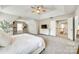 Bright main bedroom featuring a tray ceiling, carpet, and built-in shelving at 1813 Robbins Meadows Dr, Waxhaw, NC 28173