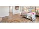 Bright bedroom with wood-look flooring, natural light, and neutral decor at 205 Jim Patterson Rd, Kings Mountain, NC 28086