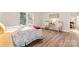 Airy bedroom with vinyl floors, a comfortable bed, and large windows at 205 Jim Patterson Rd, Kings Mountain, NC 28086