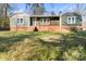 Charming exterior of a cozy home featuring a quaint porch and a brick foundation at 205 Jim Patterson Rd, Kings Mountain, NC 28086
