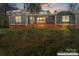 Charming exterior of a cozy home featuring a quaint porch and a brick foundation at 205 Jim Patterson Rd, Kings Mountain, NC 28086