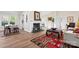Bright living room featuring a cozy fireplace, hardwood floors, and natural light at 205 Jim Patterson Rd, Kings Mountain, NC 28086