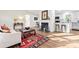 Bright living room featuring a cozy fireplace, hardwood floors, and natural light at 205 Jim Patterson Rd, Kings Mountain, NC 28086
