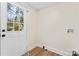 Bright mudroom with white door to the exterior and washer/dryer hookups, all with vinyl flooring at 205 Jim Patterson Rd, Kings Mountain, NC 28086