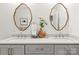 Elegant bathroom with double sink vanity, decorative mirrors, and stylish fixtures at 211 Killian Rd, Stanley, NC 28164