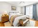 Cozy bedroom featuring a large bed, wood floors, and neutral decor at 211 Killian Rd, Stanley, NC 28164