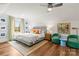 Bright, airy bedroom with hardwood floors, comfortable seating, and large windows at 211 Killian Rd, Stanley, NC 28164