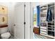 Bright, walk-in closet boasts custom shelving for optimal organization and storage at 211 Killian Rd, Stanley, NC 28164