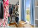Spacious closet provides ample storage with custom shelves, hanging rods, and a bright window at 211 Killian Rd, Stanley, NC 28164