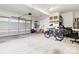 Clean and organized garage with ample space, shelving, and overhead storage at 211 Killian Rd, Stanley, NC 28164