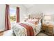 Inviting main bedroom featuring a plush bed, stylish décor, and a sunlit window at 211 Killian Rd, Stanley, NC 28164