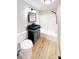 Bathroom featuring dark vanity, shower and tub, and wood floor at 2210 22Nd Avenue Se Ct, Hickory, NC 28602